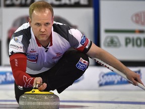 Team Canada third Mark Nichols throws a rock against Germany during the world men's curling championship at Northlands Coliseum  in Edmonton on Tuesday night.