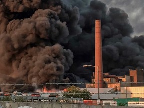 Huge plumes of black smoke rise from a fire at the HTI facility on Stevens Street in Lockport N.Y. on Aug. 10th, 2016.