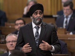 Minister of National Defence Harjit Sajjan rises during Question Period in the House of Commons on Parliament Hill, Friday, April 7, 2017 in Ottawa.