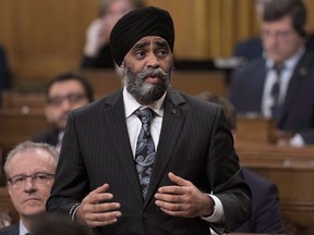 Minister of National Defence Harjit Sajjan rises during Question Period in the House of Commons on Parliament Hill, Friday, April 7, 2017 in Ottawa