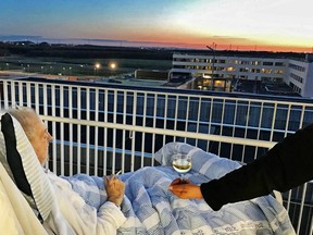 Danish man Carsten Flemming Hansen enjoying his final requests while watching the sunset at Aarhus University hospital.