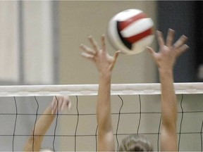Sam Siebeneich (L) with the Riffel Royals fires a shot as Kyra Kirkham-Palmer (R) with the Campbell Tartans tries to block the shot during the Regina High School Athletic  Association 5A Girls volleyball final at the U of Regina on November 13, 2012.