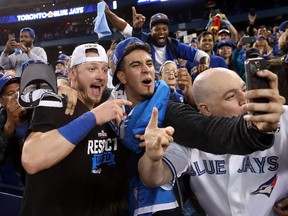 Josh Donaldson celebrates with fans after the Toronto Blue Jays defeated the Texas Rangers 7-6 in Game 3 of the 2016 American League Division Series at Rogers Centre.