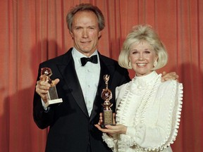 Clint Eastwood poses with Doris Day at the 46th annual Golden Globe Awards in Beverly Hills, Calif. on Jan. 29, 1989.