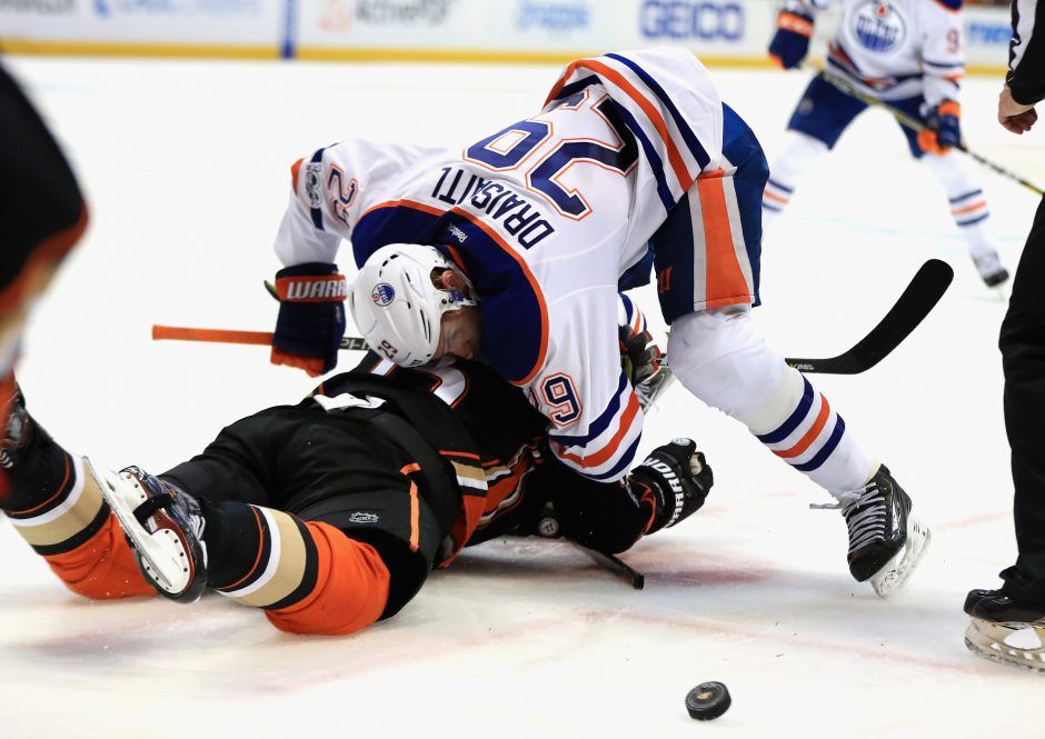 Edmonton Oilers left wing Milan Lucic, top, and Anaheim Ducks defenseman  Cam Fowler battle for the puck during the third period in Game 2 of a  second-round NHL hockey Stanley Cup playoff