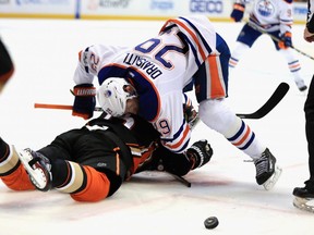 Leon Draisaitl #29 of the Edmonton Oilers pushes Ryan Getzlaf #15 of the Anaheim Ducks to the ice  in the second period in Game One of the Western Conference Second Round during the 2017  NHL Stanley Cup Playoffs at Honda Center on April 26, 2017 in Anaheim, California.
