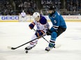 Ryan Nugent-Hopkins #93 of the Edmonton Oilers and David Schlemko #5 of the San Jose Sharks go for the puck during Game Six of the Western Conference First Round during the 2017 NHL Stanley Cup Playoffs at SAP Center on April 22, 2017 in San Jose, California.