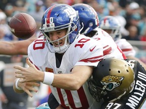 Did New York Giants quarterback Eli Manning fumble his contractual obligations to memorabilia dealers?