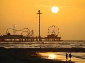 The historic Pleasure Pier, with thrill rides, a midway and restaurants built over the Gulf of Mexico, is the iconic Galveston backdrop.