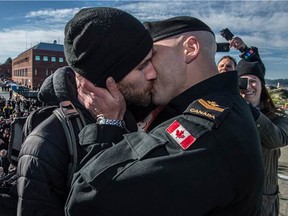 Master Seaman Francis Legare shares the coveted 'first kiss' with partner Corey, after the arrival and docking of Her Majesty’s Canadian Ship (HMCS) WINNIPEG on February 23, 2016
