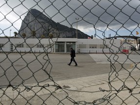 A man walks at the Spain-Gibraltar border on April 3, 2017 in La Linea de la Concepcion, in Spain.