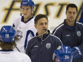 AHL's Utica Comets (Vancouver Canucks farm team) coach Travis Green (centre) directs players at practice at Abbotsford Entertainment and Sports Centre on November 28, 2013.