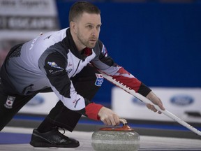 Team Canada skip Brad Gushue is focused on the target as he delivers a stone during action at the Ford World Men's Curling championship in Edmonton on Sunday. Gushue won a pair of games on Sunday to sit as the lone unbeaten rink in the competition at 3-0.