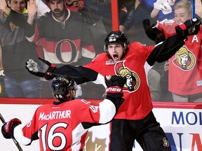 Ottawa Senators right wing Bobby Ryan (right) celebrates his Game One goal against the Boston Bruins with Clarke MacArthur on April 12.