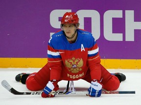 In this Feb. 13, 2014 file photo, Alex Ovechkin stretches before a Russia-Slovenia game at the Sochi Olympics.
