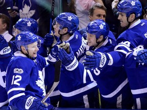 Toronto Maple Leafs right wing Connor Brown (12) celebrates with teammates after a goal during third period NHL hockey action against the Pittsburgh Penguins, in Toronto on Saturday, April 8, 2017. THE CANADIAN PRESS/