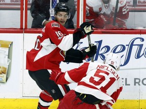 Clarke MacArthur of the Senators looks for a pass as Detroit Red Wings' Frans Nielsen closes in during first period action in Ottawa on Tuesday night.