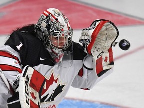 Canada goaltender Shannon Szabados makes a glove save against the United States on March 31.