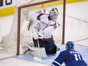Washington Capitals' goaltender Braden Holtby knocks down a shot from Zach Hyman of the Toronto Maple Leafs during Game 6 action Sunday night in Toronto. Holtby was a standout as the Caps won 2-1 in overtime to win the series in six games.