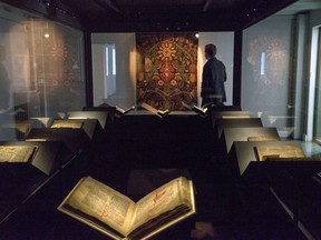 In this photo taken Saturday, April 15, 2017, a law book penned on calf-skin in 1363 is displayed at a museum in Reykjavik. The revered Icelandic language, seen by many as a source of identity and pride, is being undermined by the widespread use of English both for mass tourism and in the voice-controlled artificial intelligence devices coming into vogue.