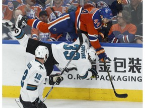 Edmonton's Zack Kassian hits San Jose's Logan Couture during the second period of Game 2 of the NHL playoffs series at Rogers Place in Edmonton on Friday, April 14, 2017.