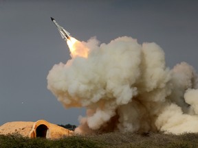 A long-range S-200 missile is fired in a military drill in Bushehr, Iran.