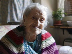 In this Friday, June 26, 2015 file photo, Emma Morano sits in her apartment in Verbania, Italy. An Italian doctor says Saturday, April 15, 2017 Emma Morano, at 117 the world's oldest person, has died in her home in northern Italy. Dr. Carlo Bava told The Associated Press by telephone that Morano's caretaker called him to say the woman had passed away Saturday afternoon while sitting in an armchair in her home in Verbania, a town on Lake Maggiore.