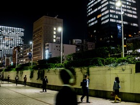People head home after a very long work day in Tokyo, Japan.