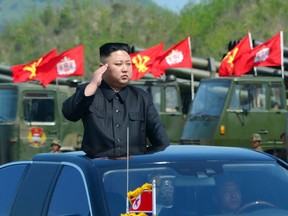 This photo released by North Korea shows Kim Jong-Un attending the combined fire demonstration of the services of the Korean People's Army in celebration of its 85th founding anniversary at the airport of eastern front.