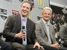 Dean Lombardi, left, president and general manager of the Los Angeles Kings, and head coach Darryl Sutter are shown in happier times. Both were fired by the Kings on Monday after the team missed the playoffs for the second time in three seasons.