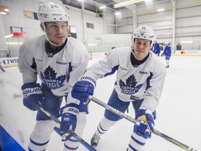 Brian Boyle (left) and Matt Martin skate during a Toronto Maple Leafs practice at the MasterCard Centre in Toronto on April 11.