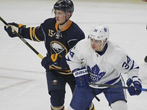 Toronto Maple Leafs' rookie Auston Matthews, right, established a franchise rookie scoring record with his 67th point in Monday's 4-2 win over the Buffalo Sabres. Matthews also set a record goals record with his 39th of the season. At left is Buffalo's Jack Eichel.
