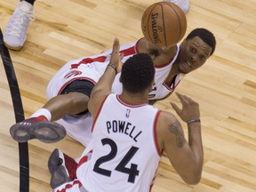 Toronto Raptors' Kyle Lowry, battling a bad back, hits the floor as he tries to get the ball to teammate Norman Powell during Game 5 action in their first-round NBA playoff series Monday night at the ACC in Toronto. The Raptors were 118-93 winners over the Milwaukee Bucks, giving them a 3-2 edge in the series heading back to Milwaukee for Game 6 on Thursday.