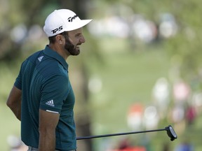 Dustin Johnson smiles on the seventh green during a practice round for the Masters on April 4.