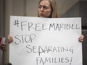 In this Tuesday, April 11, 2017 photo, Tracy Kemme of the Delhi Sisters of Charity, stands outside of the 6th U.S. Circuit Court of Appeals while advocating for Maribel Trujillo Diaz in Cincinnati