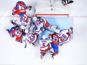 New York Rangers goaltender Henrik Lundqvist tracks the puck in a scramble against the Montreal Canadiens on April 20.