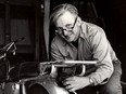 This 1975 image released by William Morrow shows author Robert M. Pirsig working on a motorcycle.