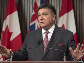 Ontario Finance Minister Charles Sousa discusses the federal budget at a news conference in Toronto on March 22, 2017.