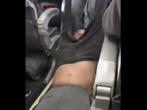 Would-be United Express passenger David Dao is dragged from the plane after refusing to give up his seat on the overbooked flight.