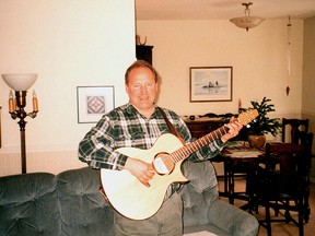 Paul Hepher, at his brother’s home in Lethbridge, about a year before he was murdered. Hepher, an amateur musician, is playing a guitar that was gift from his nephew, Robin.