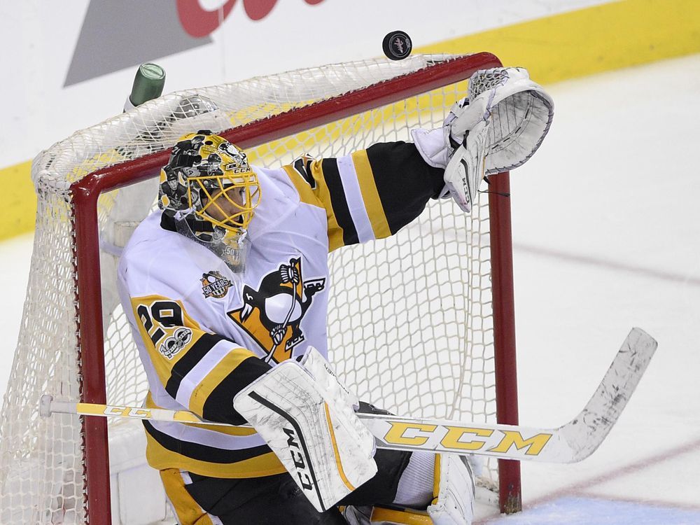 Pittsburgh Penguins goalie Marc-Andre Fleury makes a save against