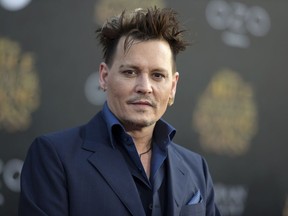 FILE - In this May 23, 2016, file photo, Johnny Depp arrives at the premiere of "Alice Through the Looking Glass" at the El Capitan Theatre, in Los Angeles. Depp's former business managers called him a "habitual liar" in a statement on April 26, 2017. The managers were responding to Depp's criticism of them in The Wall Street Journal. (Photo by Richard Shotwell/Invision/AP, File)