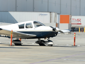 A small airplane sits in a warehouse parking lot Tuesday morning, April 4, 2017,  in Whittier, Calif., the day after the pilot, Darrell Roberts, made an emergency landing.