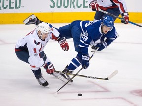 Toronto Maple Leafs forward William Nylander (right) attempts to maintain control of the puck against Washington Capitals defenceman Dmitry Orlov on April 23.
