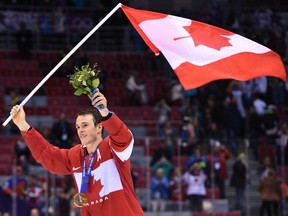 In this Feb. 23, 2014 file photo, Jonathan Toews celebrates Canada's gold medal at the Sochi Olympics.