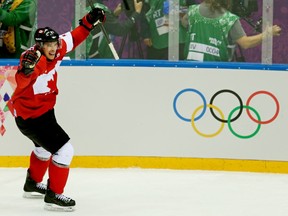 In this Feb. 23, 2014 file photo, Sidney Crosby celebrates his goal against Sweden in the Sochi Olympic hockey final.