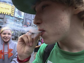 A young man blows a joint just around the 4:20 p.m. mark as Emery speaks to people at the square. The  so-called "Prince of Pot " Marc Emery was in Toronto on Thursday August 14, 2014 at Yonge Dundas Square speaking to like-minded cannabis culture friends after his recent release from a five-year term in the U.S. penal system . He has already begun to campaign for a renewed effort to legalize marijuana in Canada.