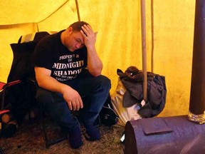 Hunger striker Richard Gillett, vice-president of the Federation of Independent Sea Harvesters of Newfoundland and Labrador, sits in the tent that he set up outside of the Department of Fisheries and Oceans offices in St. John's on Wednesday, April 19, 2017.