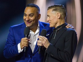 Hosts Russell Peters and Bryan Adams on stage at the Juno Awards held on Sunday at the Canadian Tire Centre.  Ashley Fraser/Postmedia