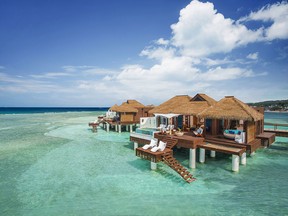 The overwater villas and bungalows at Sandals Royal Caribbean are perched over a quiet bay, with lovely Caribbean water and views that go on for miles.